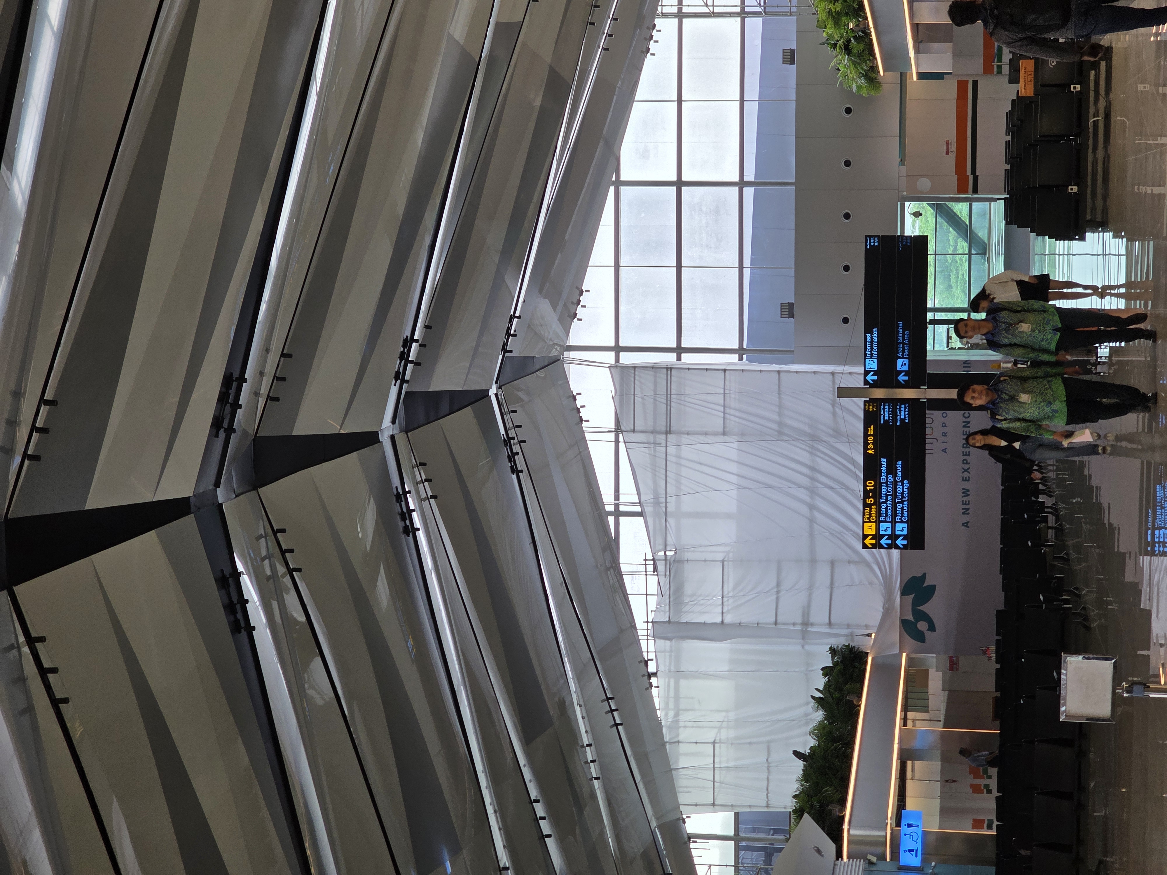 Airport terminal lighting design with uniform illumination and architectural linear lighting